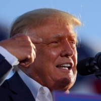 Former U.S. President Donald Trump speaks during a rally in Mesa, Arizona, on Sunday.  | REUTERS 