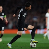 Frankfurt\'s Daichi Kamada controls the ball during a Champions League match against Tottenham in London on Wednesday. | AFP-JIJI