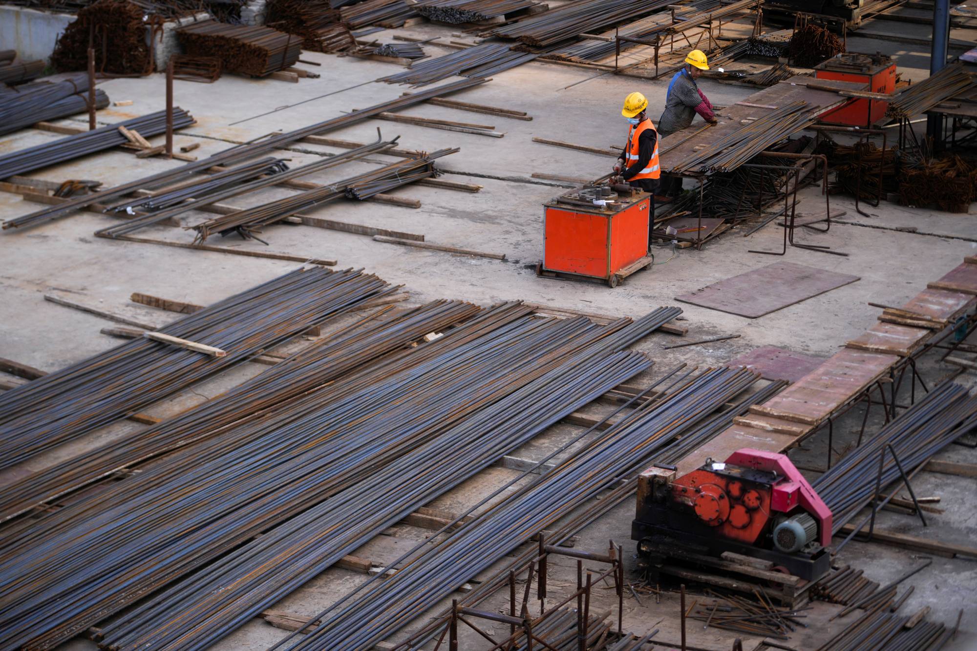 Workers at a construction site in Shanghai on Monday. Xi's 
