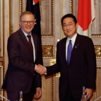 Prime Minister Fumio Kishida meets with Australian leader Anthony Albanese at \"the Quad\" leaders\' summit in Tokyo in May. | POOL / VIA REUTERS