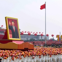 a giant portrait of Chinese President Xi Jinping in Beijing\'s Tiananmen Square during the National Day parade in October 2019.  | AFP-JIJI