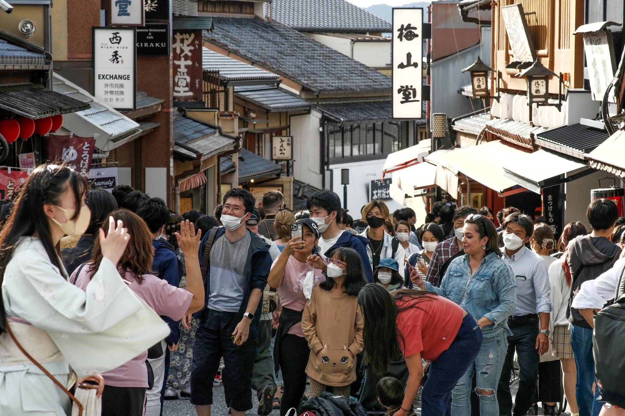 A street in Kyoto is crowded with tourists on Tuesday, when Japan significantly eased COVID-19 border controls and started the National Travel Discount program. | KYODO