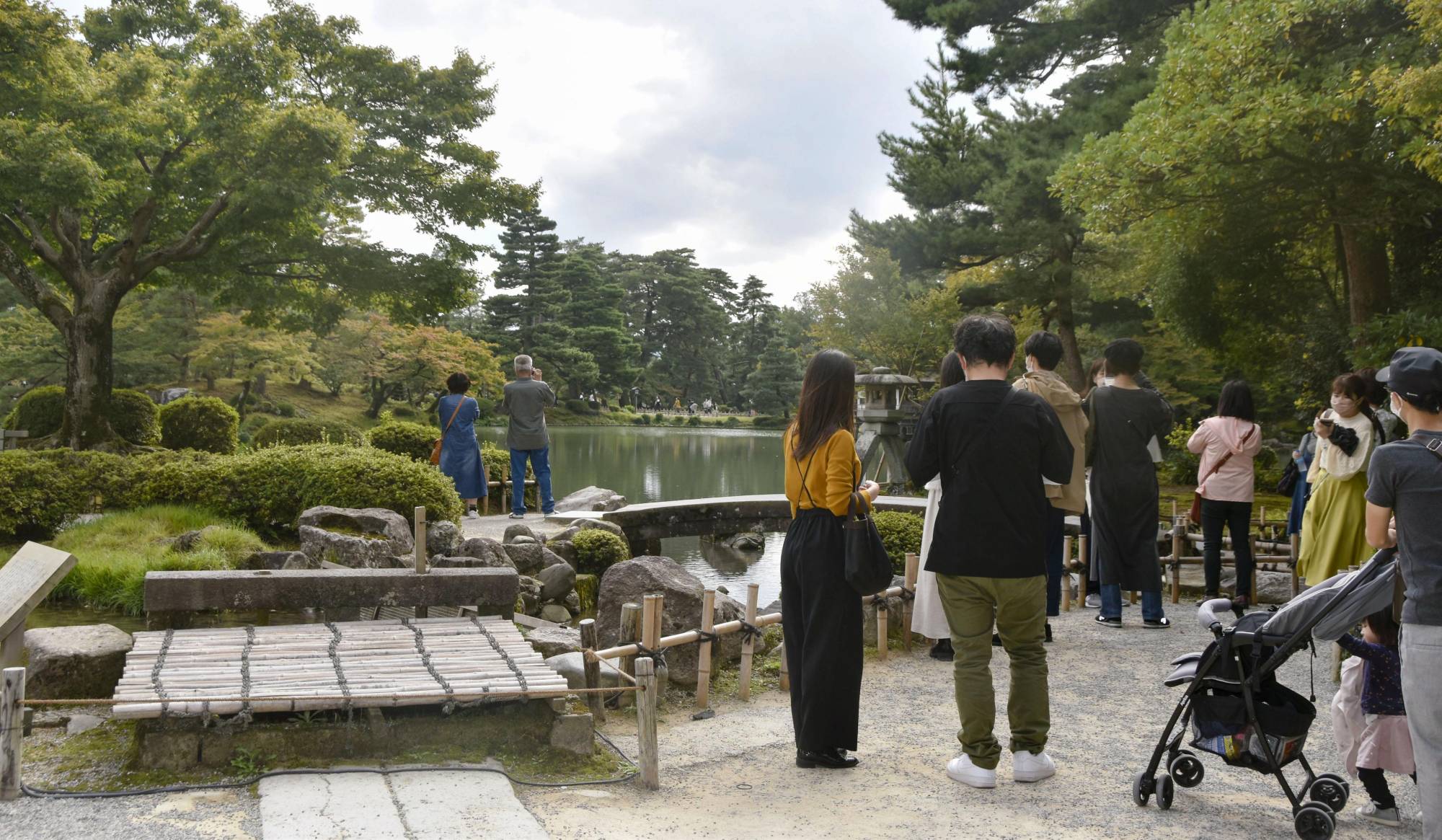 Tourists visit Kenroku-en garden in Kanazawa, Ishikawa Prefecture, on Saturday. | Kyodo
