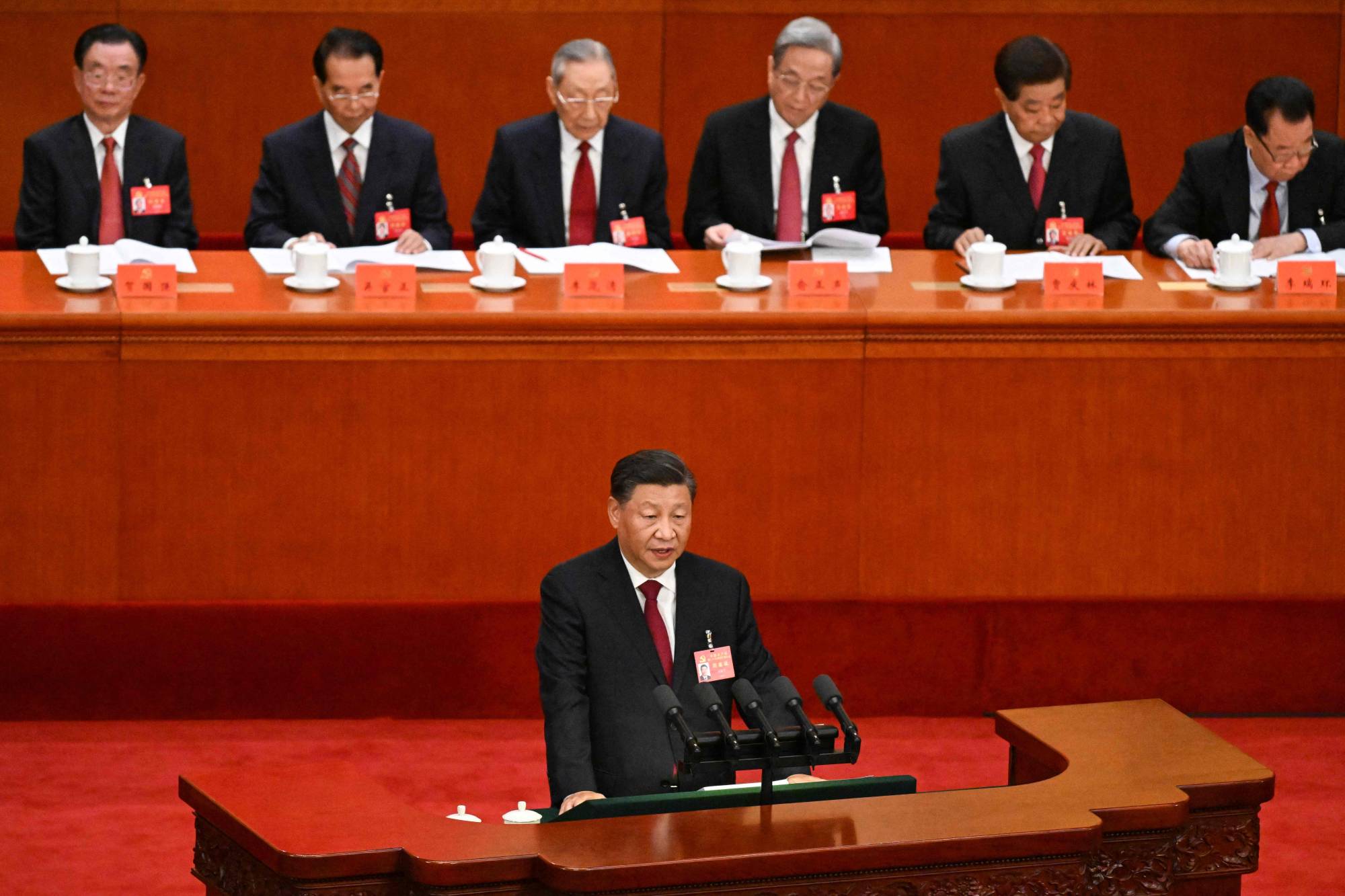 Chinese leader Xi Jinping speaks during the opening session of the 20th Chinese Communist Party's Congress at the Great Hall of the People in Beijing on Sunday. | AFP-JIJI