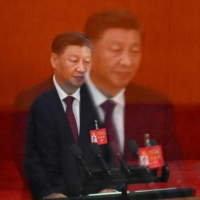 Chinese leader Xi Jinping speaks during the opening session of the 20th Chinese Communist Party\'s Congress at the Great Hall of the People in Beijing on Sunday. | AFP-JIJI
