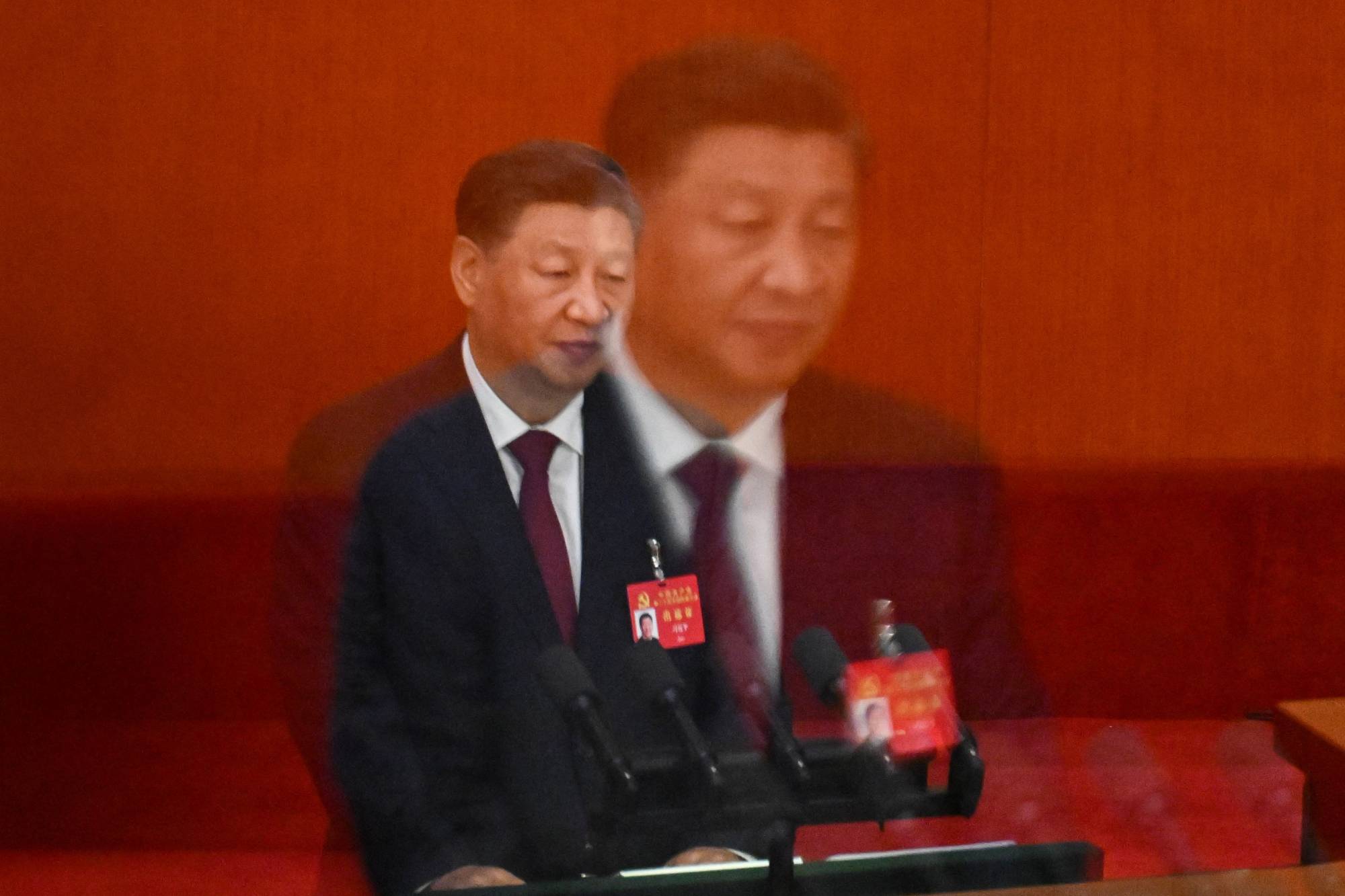 Chinese leader Xi Jinping speaks during the opening session of the 20th Chinese Communist Party's Congress at the Great Hall of the People in Beijing on Sunday. | AFP-JIJI
