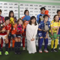 WE League Chair Haruna Takata (front, center) poses with players representing the league\'s 11 clubs at a preseason kickoff event in Yokohama on Monday. | KYODO