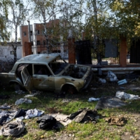 A damaged car with the letter \"Z\" on it is seen among the debris in Kupiansk, Ukraine, on Tuesday | REUTERS