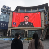 Chinese President Xi Jinping on screen during the opening session of the 20th Chinese Communist Party Congress, in Hangzhou, China, on Sunday | AFP-JIJI