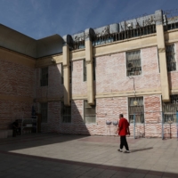 A prisoner walks in the Evin prison yard in Tehran on Monday | WANA / VIA REUTERS