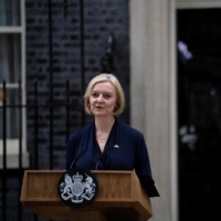 British Prime Minister Liz Truss announces her resignation outside No. 10 Downing St. on Thursday. | REUTERS