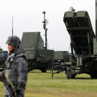 A Self-Defense Forces member takes part in a drill involving a Patriot Advanced Capability-3 (PAC-3) missile unit at the U.S. Air Force\'s Yokota Air Base in Fussa, on the outskirts of Tokyo, in August 2017. | REUTERS