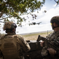 Ukrainian soldiers operate a drone near the front lines in the Kherson region in September.  | JIM HUYLEBROEK / THE NEW YORK TIMES