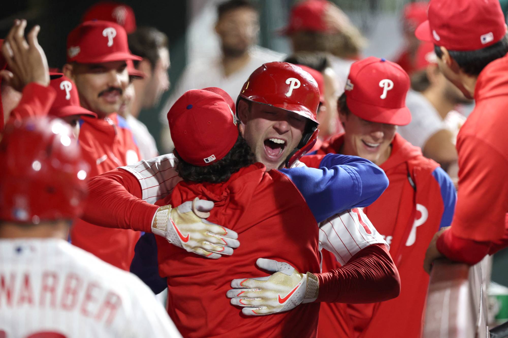 Philadelphia Phillies - Rhys Hoskins and Bryce Harper celebrating Hoskins'  solo home run.