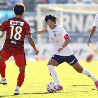 Yokohama FC midfielder Shunsuke Nakamura controls the ball against Roasso Kumamoto during his final J. League game at Egao Kenko Stadium in Kumamoto on Sunday. | KYODO