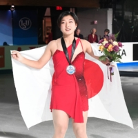 Kaori Sakamoto celebrates winning gold in the women\'s competition at Skate America in Norwood, Massachusetts on Sunday. | USA TODAY / VIA REUTERS