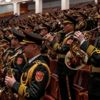 The Central Military Band of the People\'s Liberation Army plays the Communist Internationale during the closing ceremony of the Communist Party congress at Beijing\'s Great Hall of the People on Saturday. | BLOOMBERG