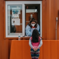 A walk-up COVID-19 test site at the Esperanza Heath Center in Chicago. An increase in cases this winter is not expected to cause a surge in deaths. | JAMIE KELTER DAVIS / THE NEW YORK TIMES