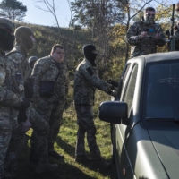 Members of a Ukrainian military unit take part in a training exercise near Kyiv. Western officials quickly rejected Russia’s claim that Ukraine was planning to use a so-called dirty bomb in its own territory.  | BRENDAN HOFFMAN / THE NEW YORK TIMES