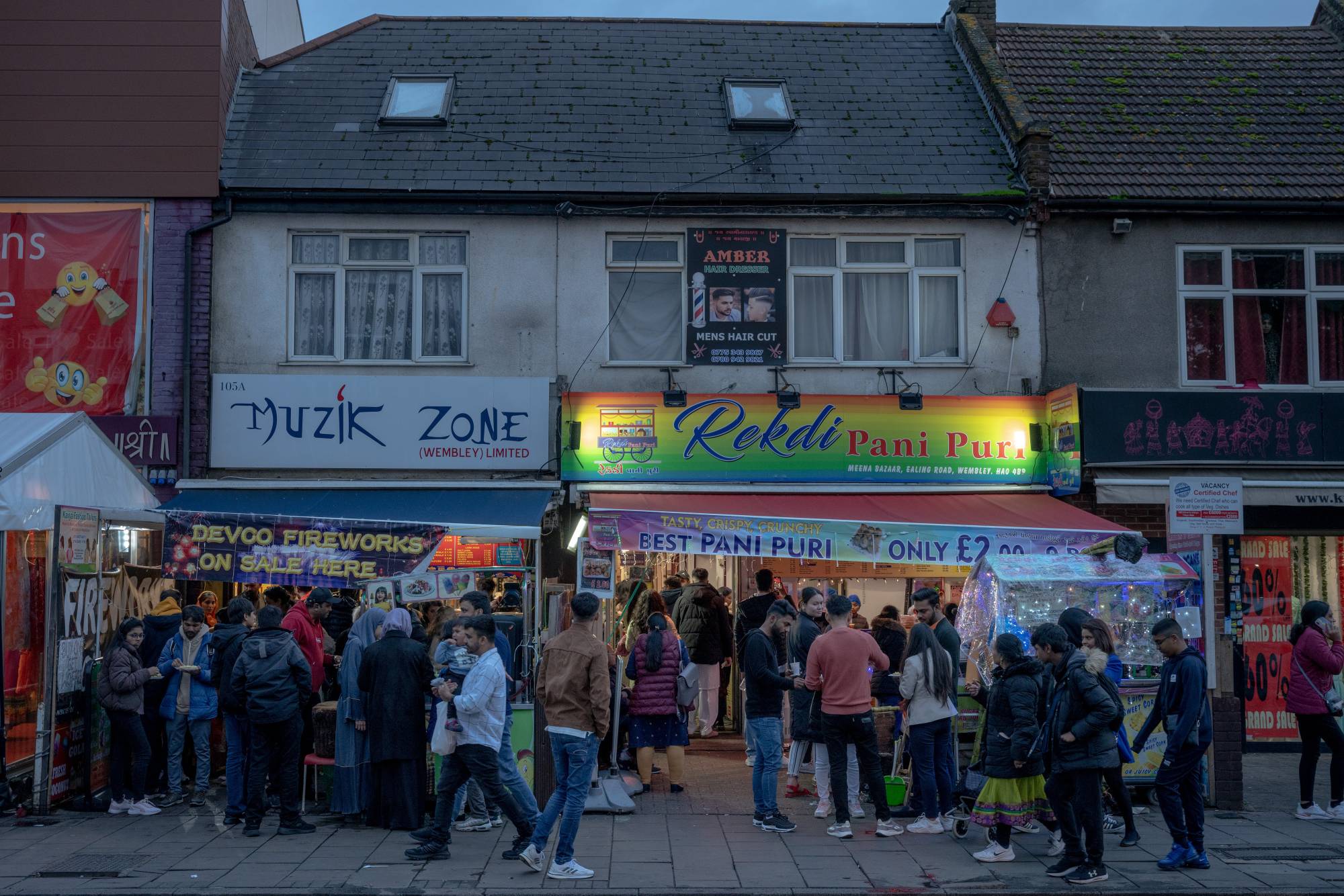 A celebration for Diwali, known as the festival of lights, in the Wembley area of northwest London, home to one of Britain’s largest Hindu communities, on Monday. Rishi Sunak’s ascent to the prime minister’s office is a significant milestone for Britain’s Indian diaspora, but for many, his immense personal wealth has made him less relatable. | Andrew Testa / The New York Times