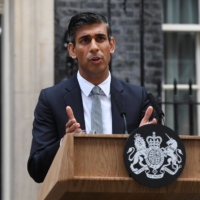 Newly-appointed U.K. Prime Minister Rishi Sunak delivers his first speech after taking office outside 10 Downing Street in London, on Tuesday. Sunak is the first person of color to lead the British government and its youngest premier in more than two centuries.  | BLOOMBERG