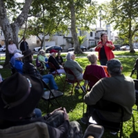 Rep. Katie Porter, a Democrat from California, campaigns outside a library in Seal Beach on June 4. Porter is under threat in the 2022 midterms, despite running in a seat that Joe Biden carried by 11 percentage points. | JENNA SCHOENEFELD / THE NEW YORK TIMES