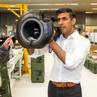 Rishi Sunak looks at an NLAW anti-tank weapon supplied to Ukraine during a visit to the Thales Defense System plant in Belfast, Northern Ireland, in August. | POOL / VIA REUTERS