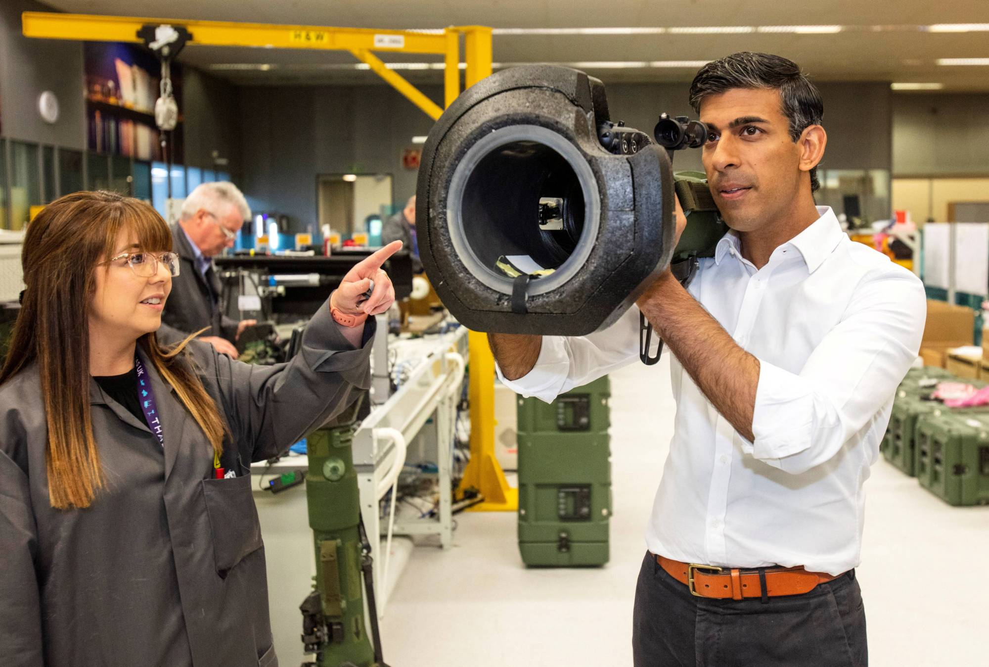 Rishi Sunak looks at an NLAW anti-tank weapon supplied to Ukraine during a visit to the Thales Defense System plant in Belfast, Northern Ireland, in August. | POOL / VIA REUTERS
