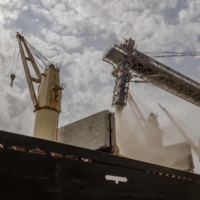 A cargo vessel chartered by the World Food Program is loaded with wheat grain at a port near Odesa, Ukraine, in August.  | DANIEL BEREHULAK / THE NEW YORK TIMES