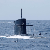 The Hai Lung SS-793 submarine surfaces during a drill near Yilan naval base, Taiwan, in April 2018 | REUTERS