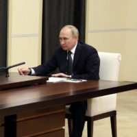 Russian President Vladimir Putin attends a meeting with Defense Minister Sergei Shoigu at the Novo-Ogaryovo state residence, outside Moscow on Friday.  | SPUTNIK / VIA REUTERS