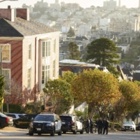 Law enforcement officials gather on the street in front of Nancy Pelosi\'s San Francisco residence on Friday.  | JIM WILSON / THE NEW YORK TIMES