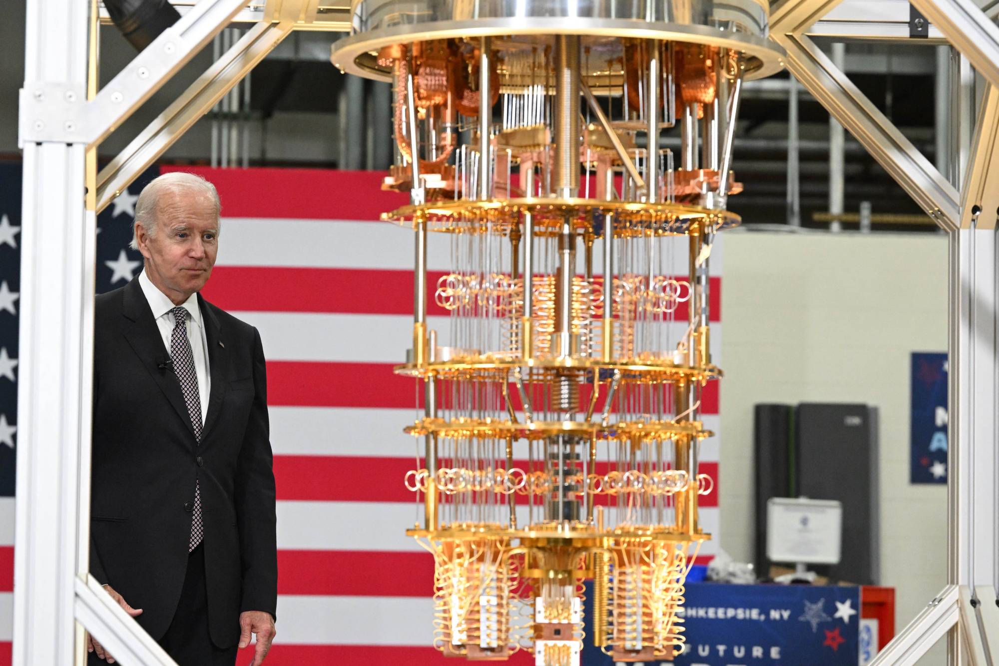 Biden looks at quantum computer as he tours the IBM facility in Poughkeepsie on Oct. 6. | AFP-JIJI