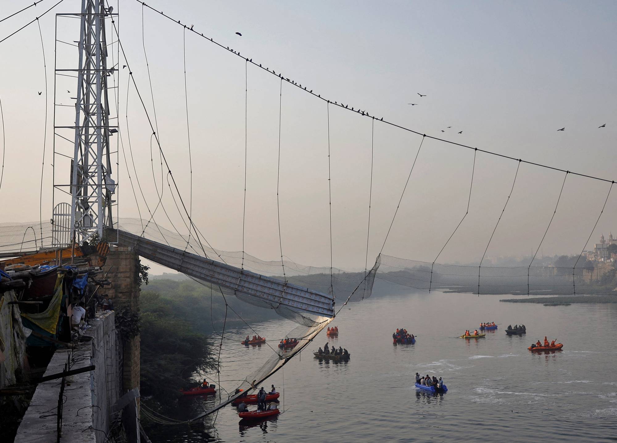 India bridge collapses into river, killing at least 130 people The