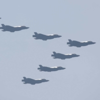 South Korean F-35A stealth fighter jets fly in formation during Armed Forces Day celebrations in Gyeryong, South Korea, on Sept. 29. | POOL / VIA REUTERS