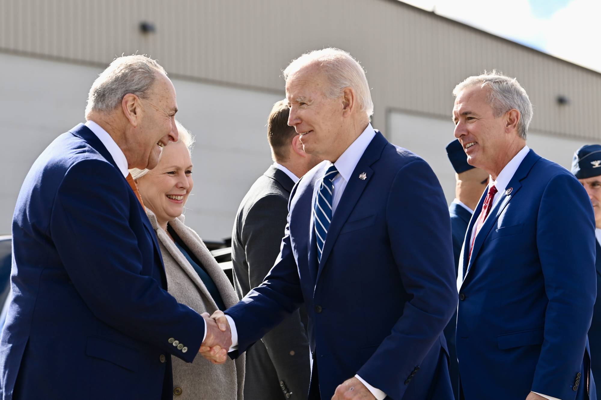 Senate Majority Leader Chuck Schumer greets U.S. President Joe Biden in Mattydale, New York, on Oct. 27. Schumer was caught on a hot microphone expressing concern about the Democrats’ chances in some key races. | KENNY HOLSTON / THE NEW YORK TIMES