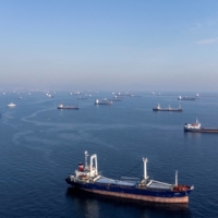 Commercial vessels including those which are part of the Black Sea grain deal wait to pass the Bosphorus strait off the shores of Yenikapi, Istanbul, on Monday. | REUTERS