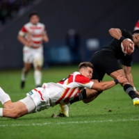 New Zealand Rugby began trialing rules requiring lower tackles in select community competitions last year. | AFP-JIJI