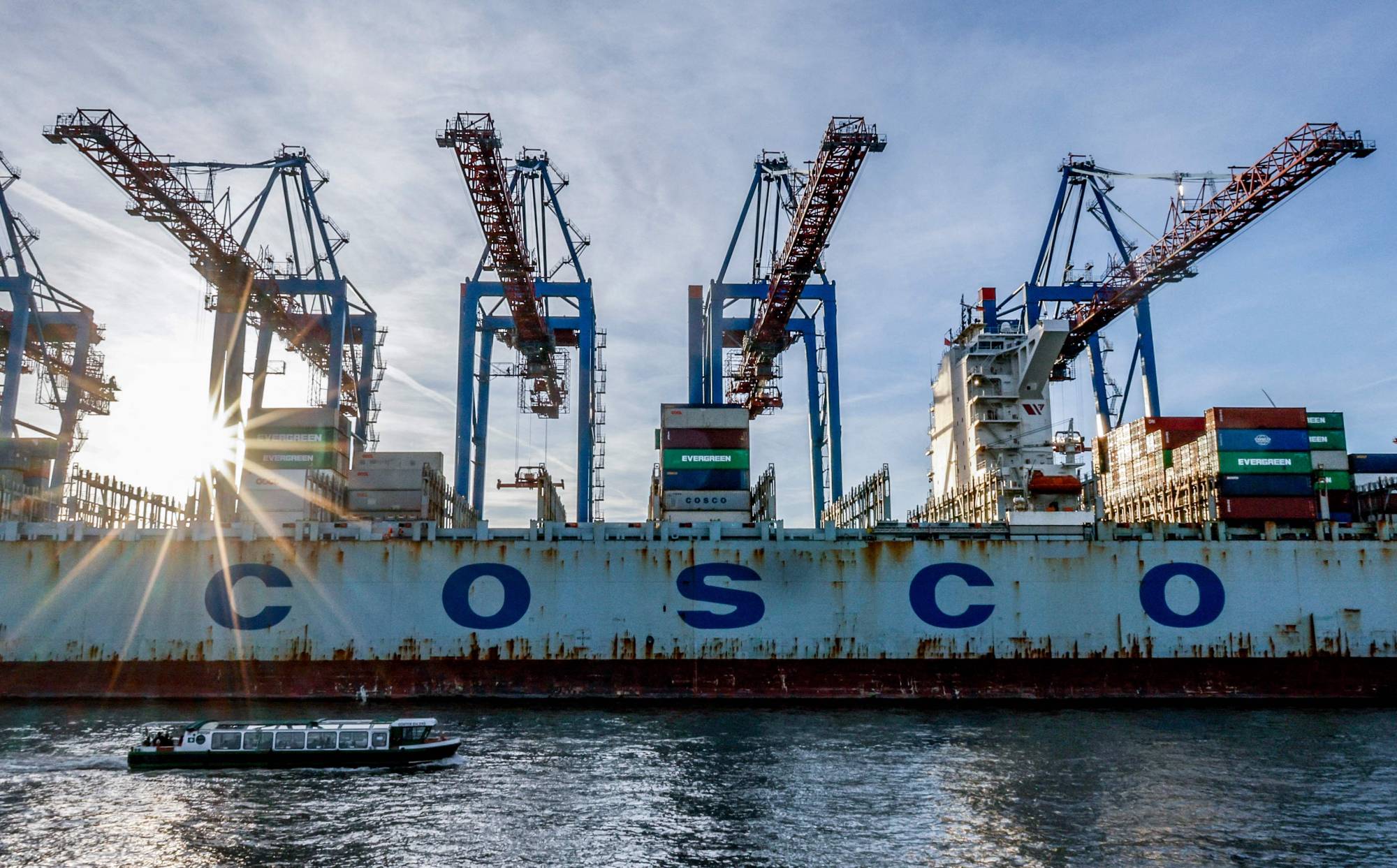 The Chinese container ship COSCO Pride is unloaded at the Tollerort Container Terminal in the harbor city of Hamburg, Germany, on Oct. 26. | AFP-JIJI