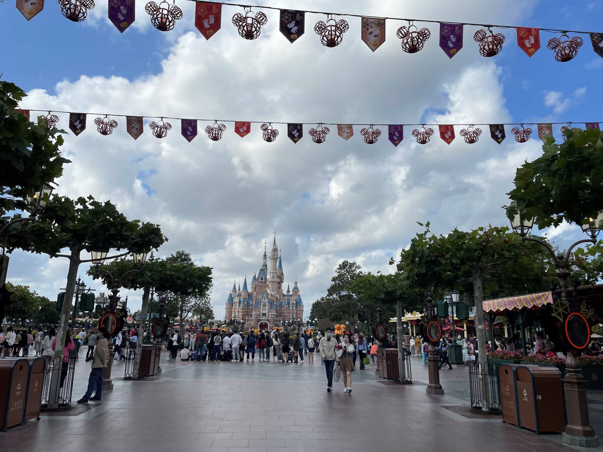 People visit Shanghai Disney Resort on Monday amid a COVID-19 outbreak in the city. | REUTERS