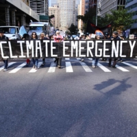Climate activists march on Park Avenue in New York in October. | AFP-JIJI