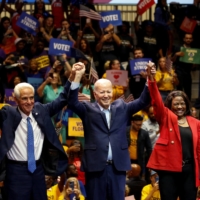 U.S. President Joe Biden and Democratic Party senatorial candidate Val Demings and gubernatorial candidate Charlie Crist during a rally in Miami Gardens, Florida, on Tuesday.  | REUTERS