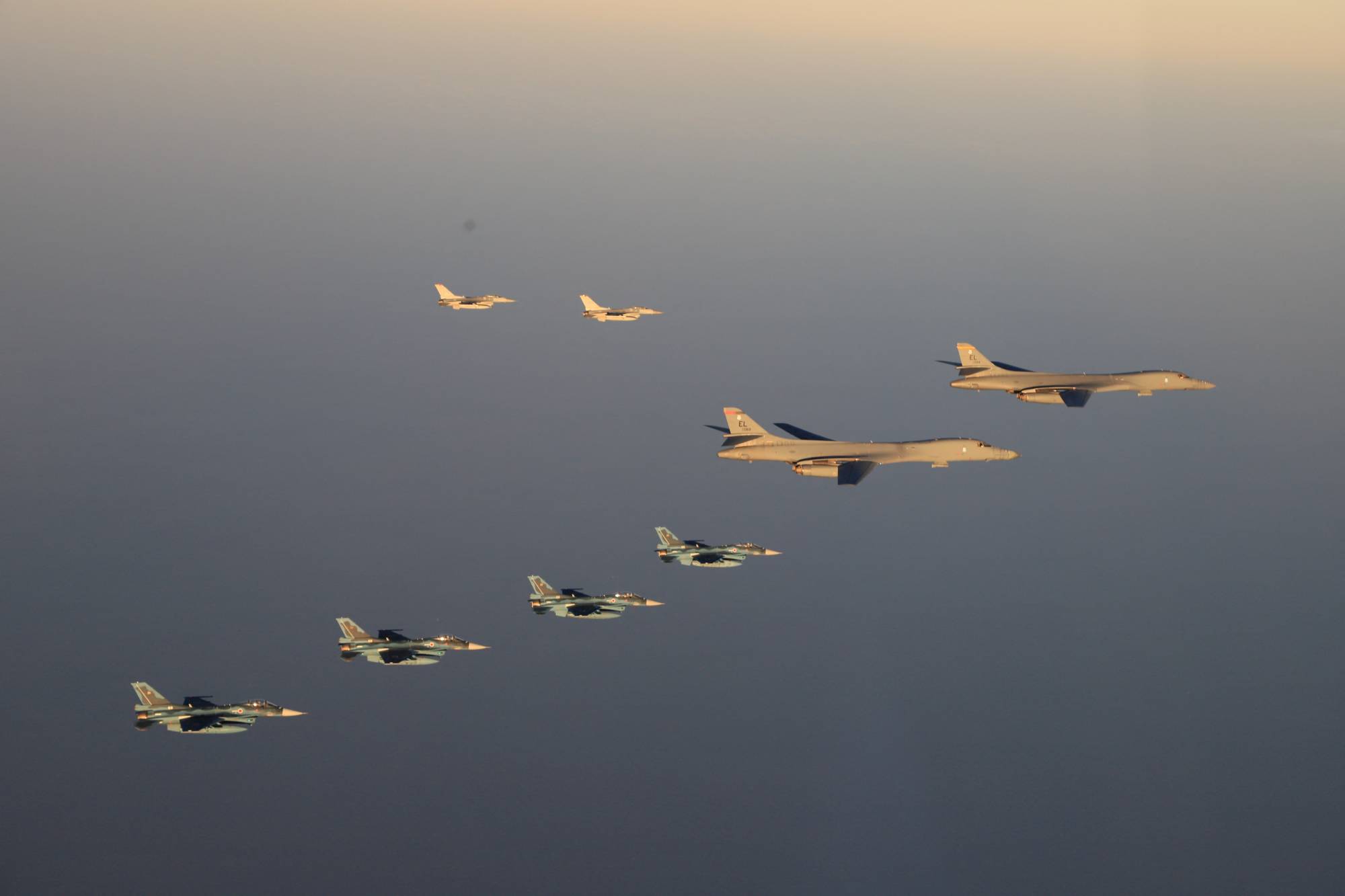 Air Self-Defense Force F-2 fighters hold a joint military drill with U.S. B-1B bombers and F-16 fighters off Kyushu on Saturday. | JOINT STAFF OFFICE OF THE DEFENSE MINISTRY OF JAPAN / VIA REUTERS