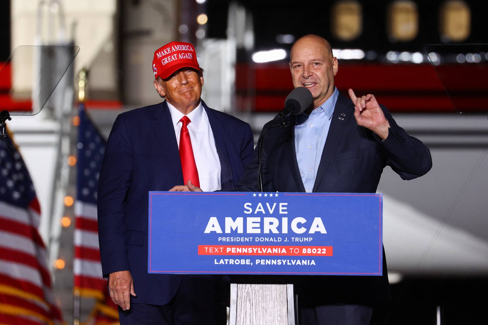 Former U.S. President Donald Trump looks on as Pennsylvania Republican candidate for governor, Doug Mastriano, speaks at a rally in Latrobe, Pennsylvania, on Saturday.  | REUTERS