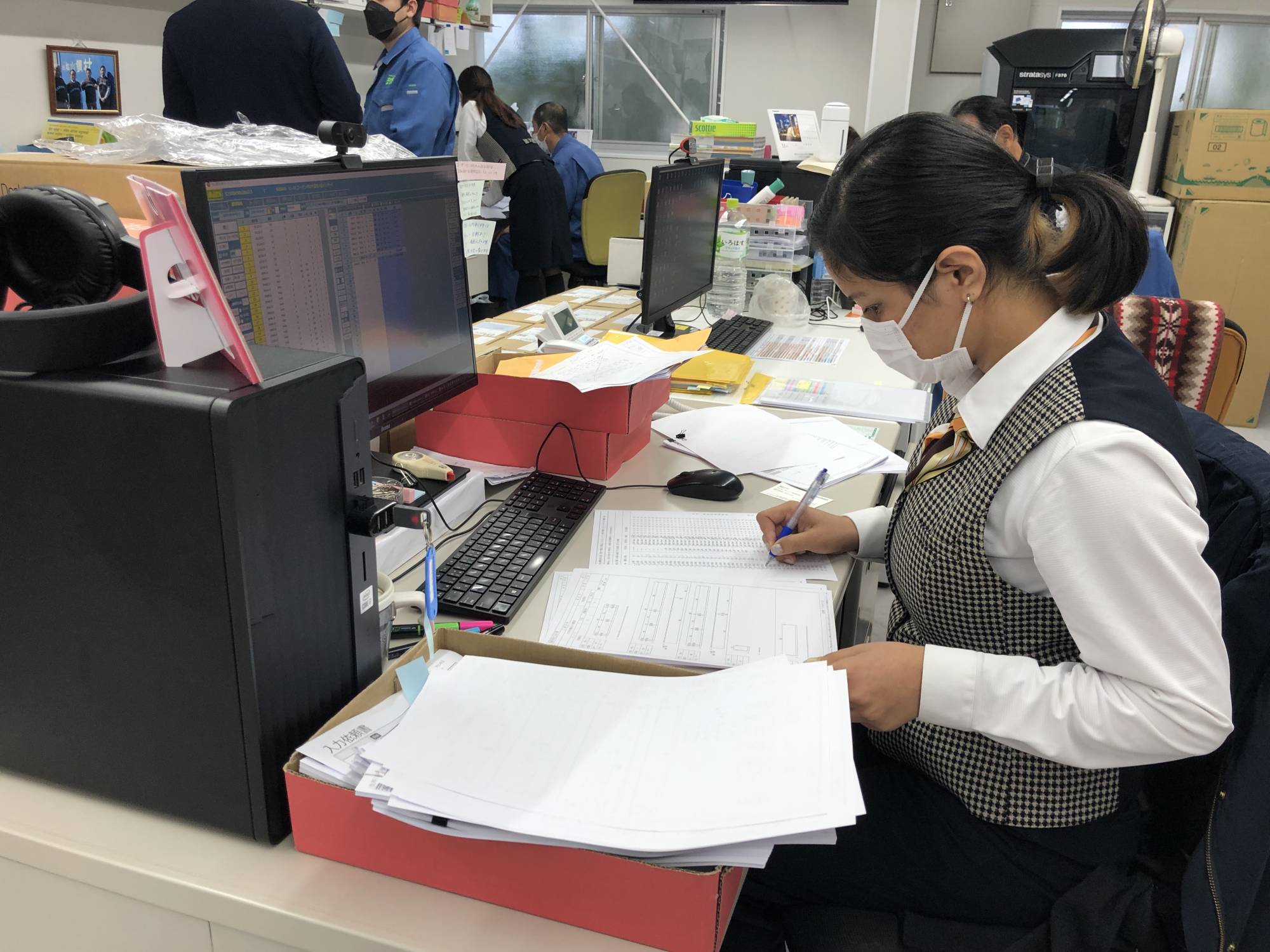 Nepalese data entry operator Sajani Shahi at work in the office of Matsuyama Kozai steelworks | WILL FEE
