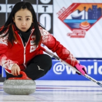 Satsuki Fujisawa helped Japan capture the inaugural Pan Continental Curling Championships in Calgary on Sunday. | AP / VIA KYODO