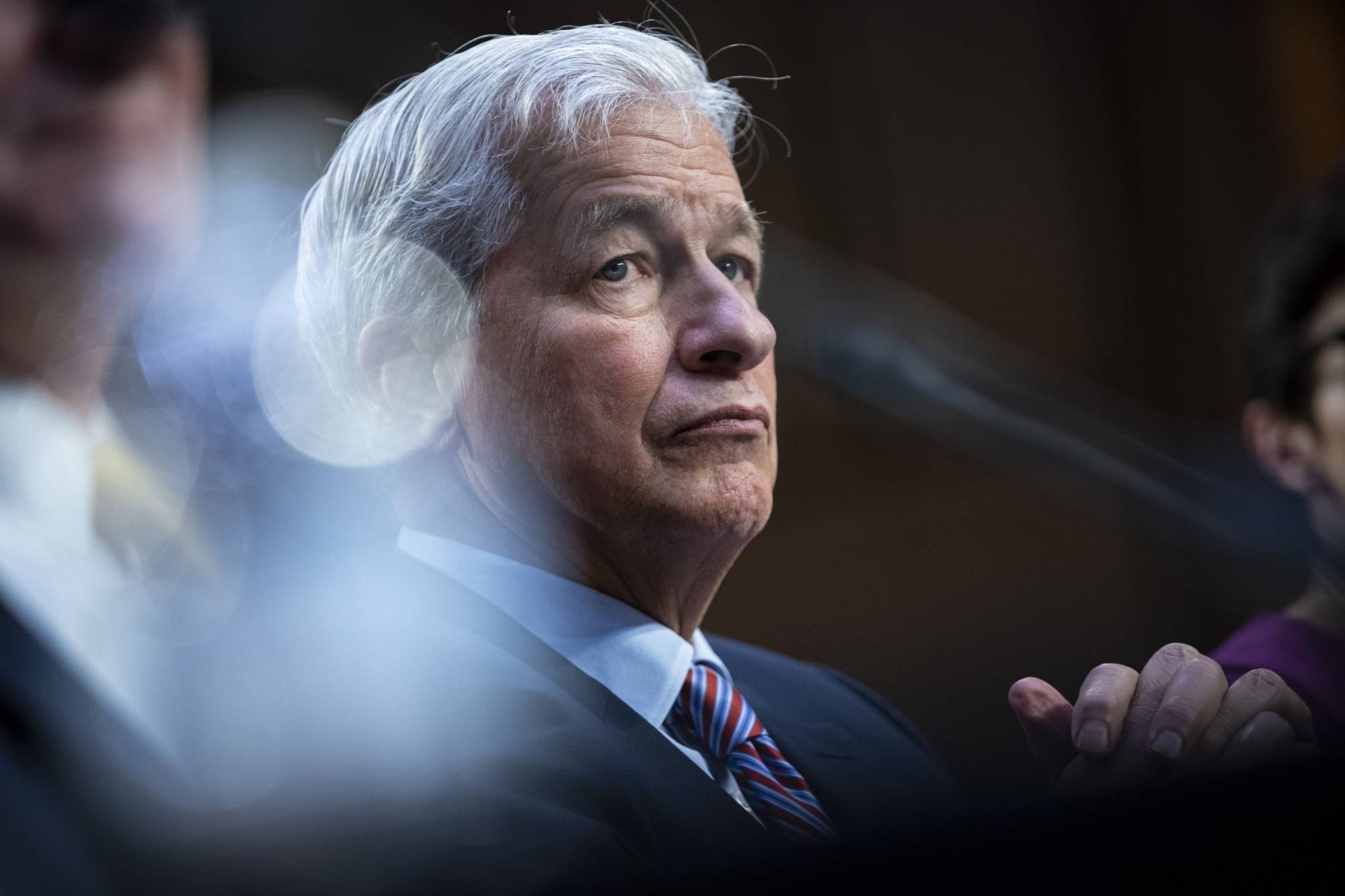 Jamie Dimon, chairman and chief executive officer of JPMorgan Chase & Co., during a Senate Banking, Housing and Urban Affairs Committee hearing in Washington on September. Dimon was asked whether his bank would sever ties with Russian companies including energy giant Gazprom PJSC. | BLOOMBERG