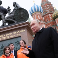 Russian President Vladimir Putin speaks with the public during Russia\'s Day of National Unity, in Red Square in central Moscow on Nov. 4. | POOL / SPUTNIK / VIA REUTERS 