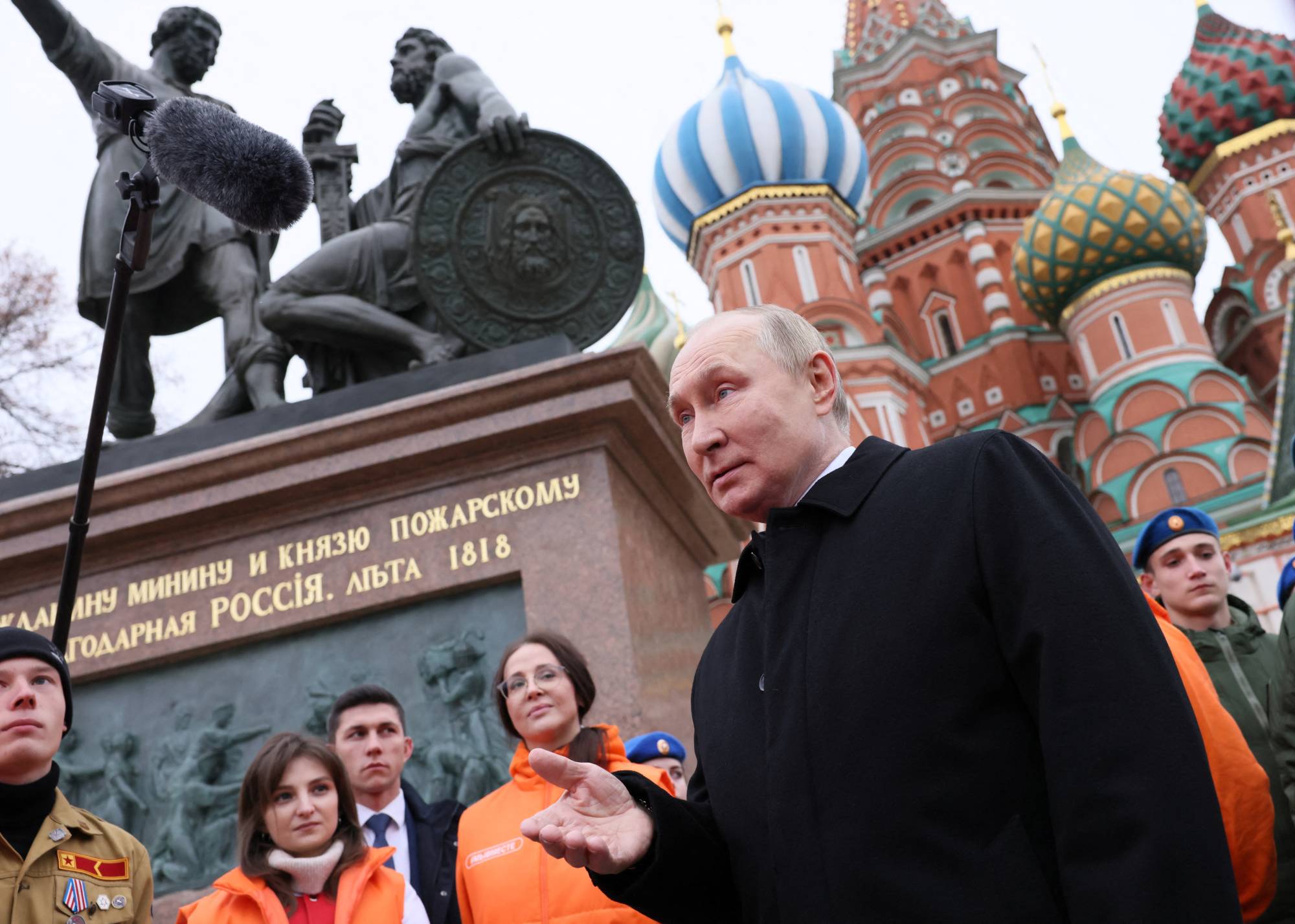 Russian President Vladimir Putin speaks with the public during Russia's Day of National Unity, in Red Square in central Moscow on Nov. 4. | Pool / Sputnik / via REUTERS 