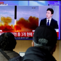 People watch a news report on North Korea firing a ballistic missile, in Seoul on Nov. 3. | REUTERS
